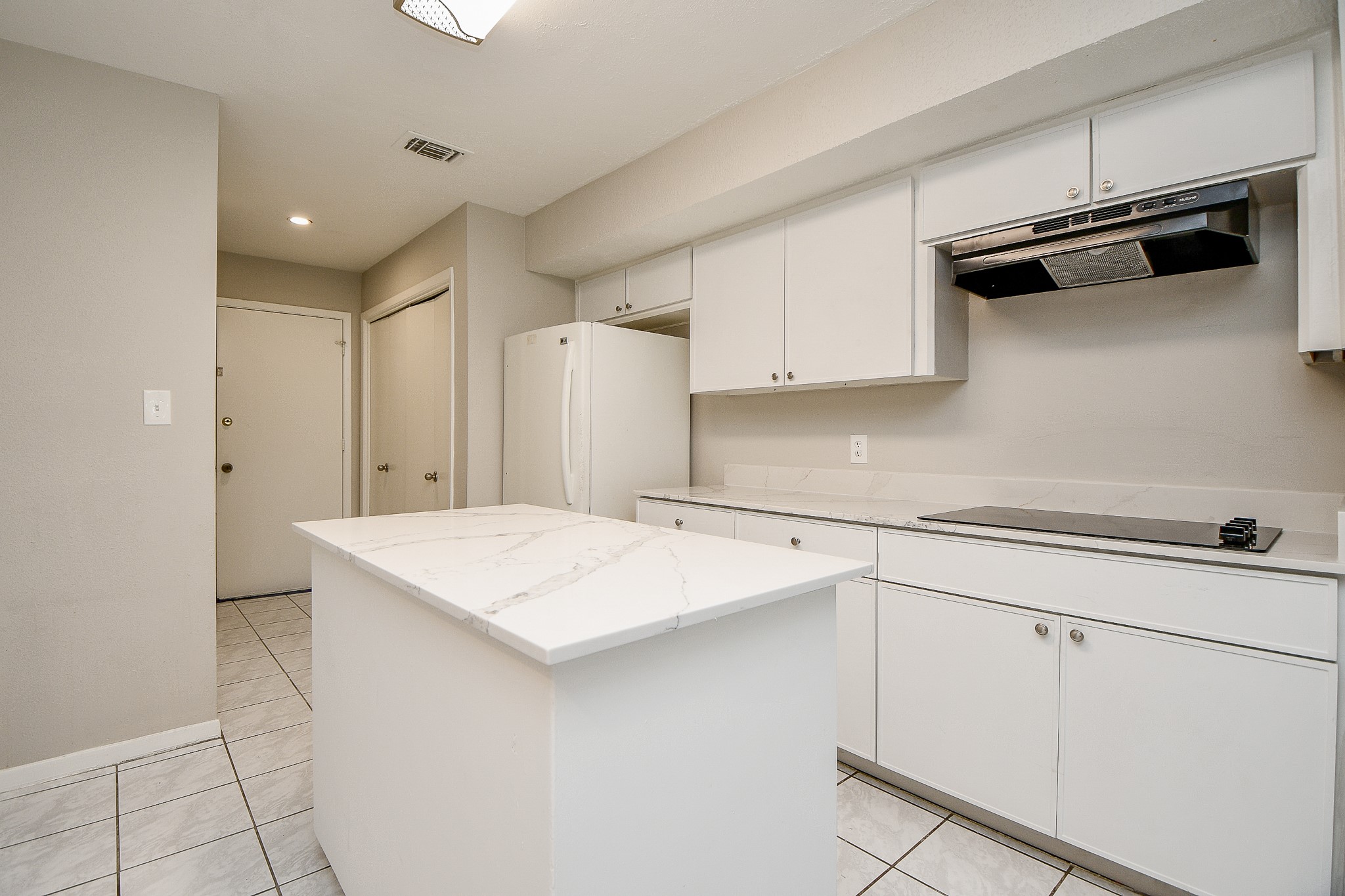 11411 Pepperdine Lane Houston, TX 77071 - Photo 18 of 31 a kitchen that has a sink a stove and cabinets
