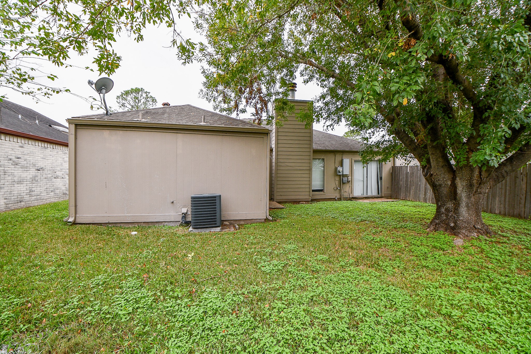11411 Pepperdine Lane Houston, TX 77071 - Photo 29 of 31 a view of a house with a yard and a large tree