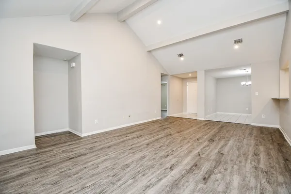 a living room with a fireplace and a floor to ceiling window