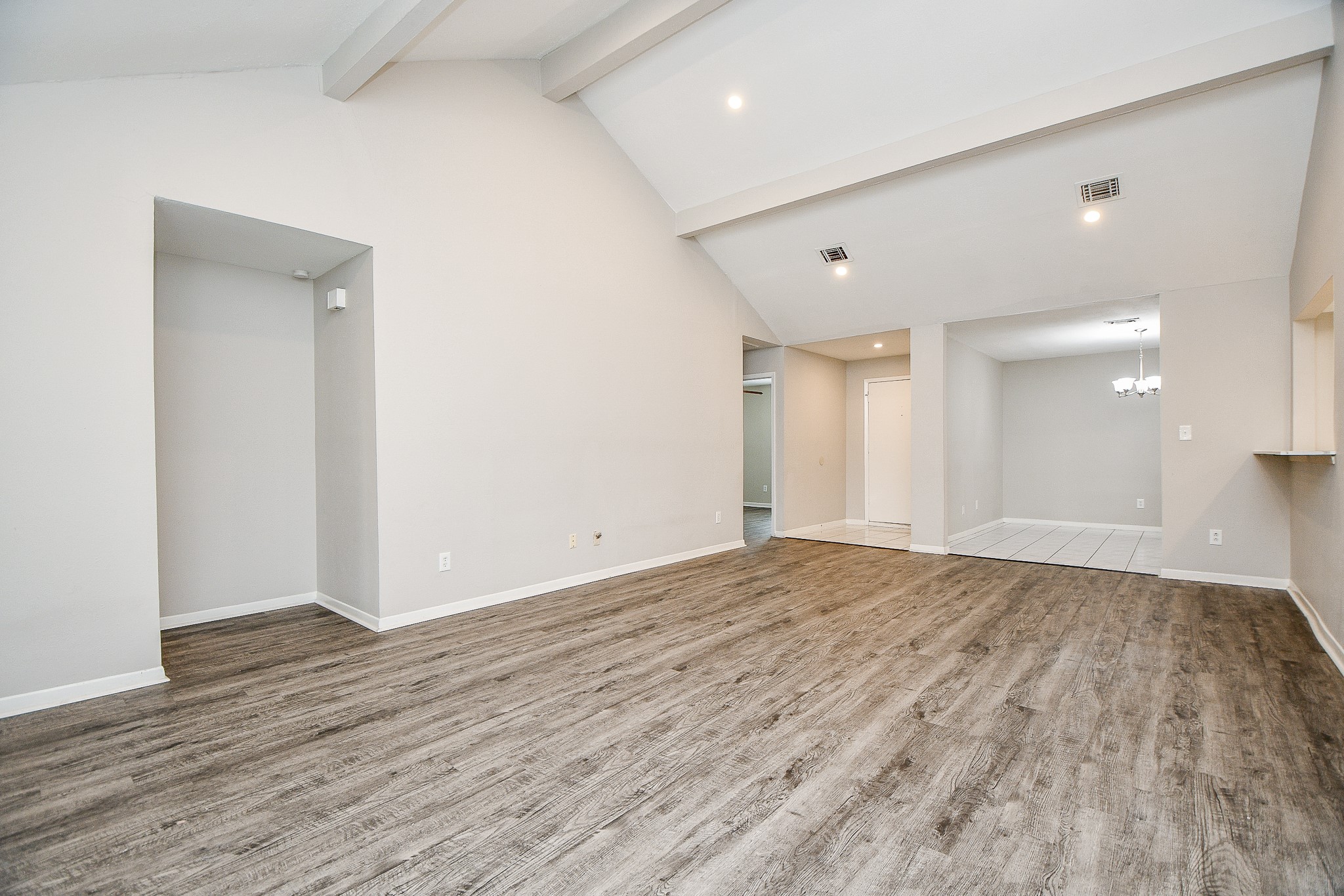 11411 Pepperdine Lane Houston, TX 77071 - Photo 8 of 31 a view of an empty room with wooden floor and a window