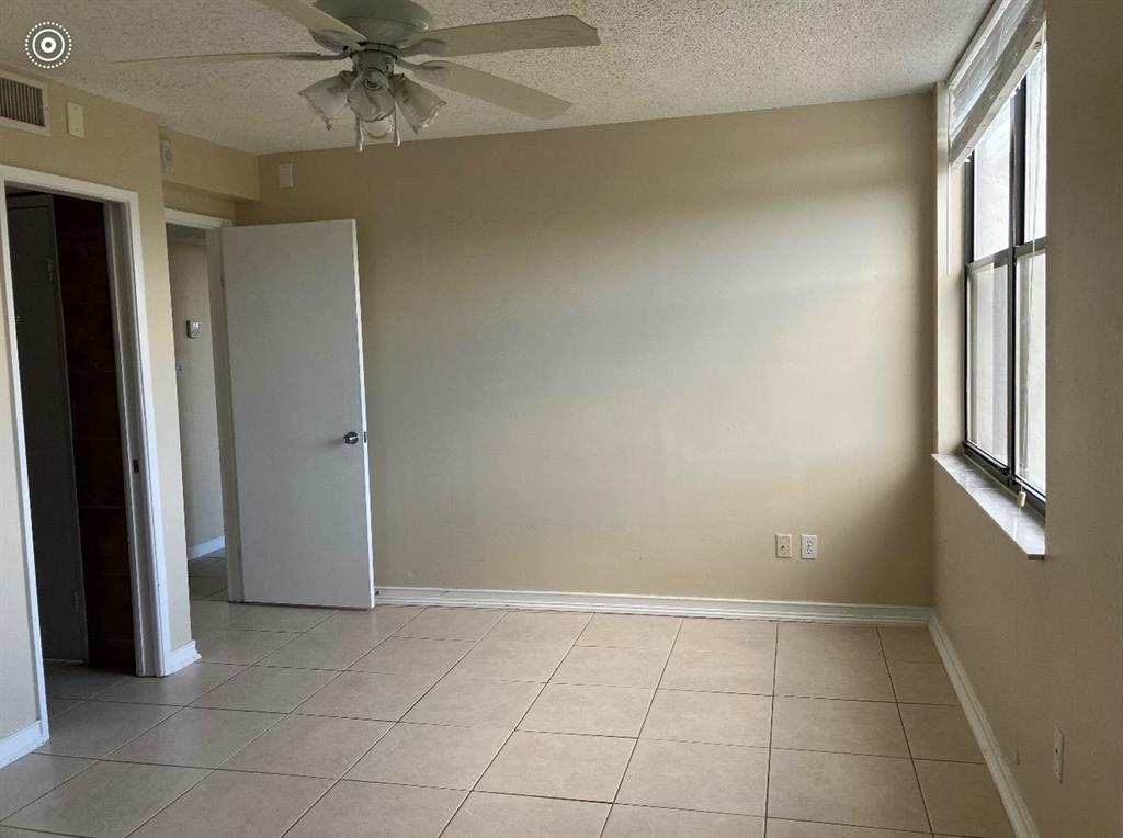950 Lavers Circle, Unit F511 Delray Beach, FL 33444 - Photo 12 of 18 a view of an empty room with a window