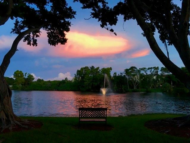 950 Lavers Circle, Unit F511 Delray Beach, FL 33444 - Photo 16 of 18 a view of a lake from a yard