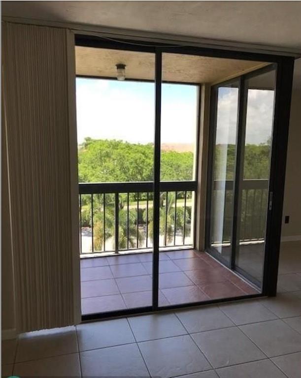 950 Lavers Circle, Unit F511 Delray Beach, FL 33444 - Photo 4 of 18 a view of a large window with an outdoor space