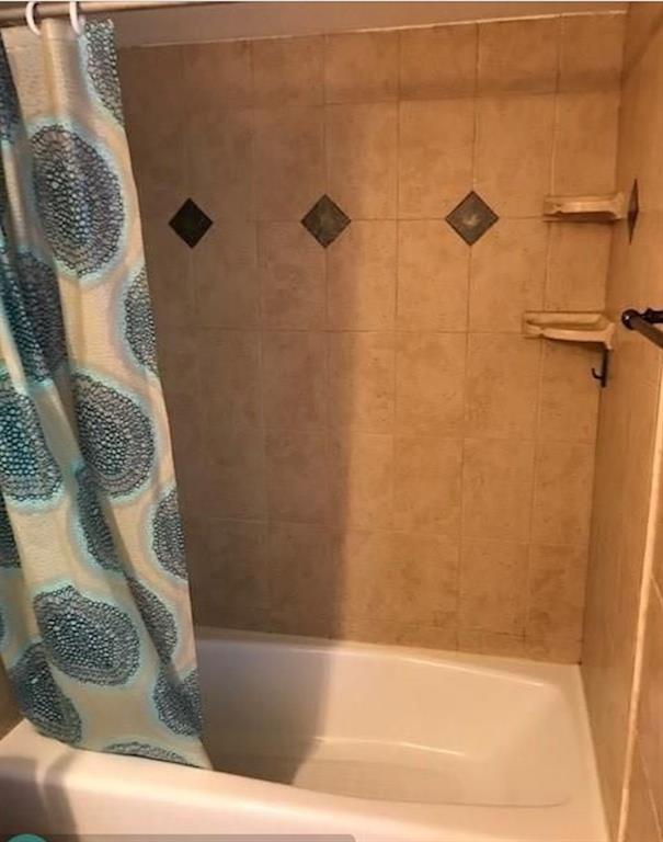 950 Lavers Circle, Unit F511 Delray Beach, FL 33444 - Photo 10 of 18 a bathroom with a shower