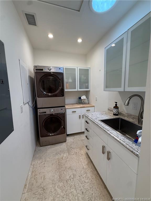 224 Southeast Wells Drive Stuart, FL 34996 - Photo 24 of 66 a kitchen with a sink a stove and cabinets