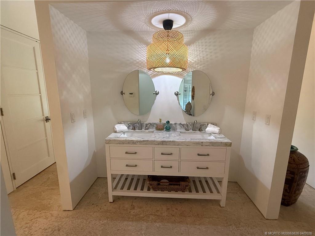 224 Southeast Wells Drive Stuart, FL 34996 - Photo 33 of 66 a bathroom with a sink and a mirror