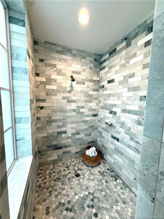 224 Southeast Wells Drive Stuart, FL 34996 - Photo 45 of 66 a bathroom with a shower