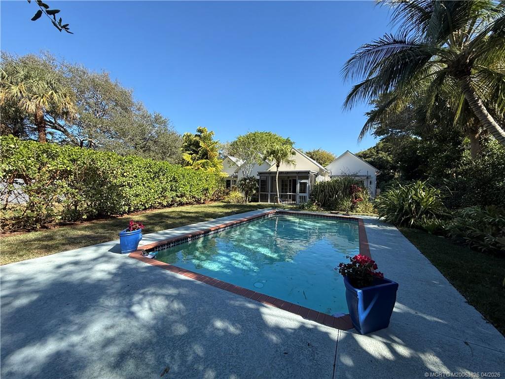 224 Southeast Wells Drive Stuart, FL 34996 - Photo 56 of 66 a view of swimming pool with a yard