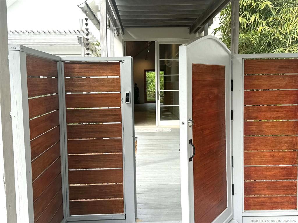 224 Southeast Wells Drive Stuart, FL 34996 - Photo 8 of 66 a view of door with wooden door
