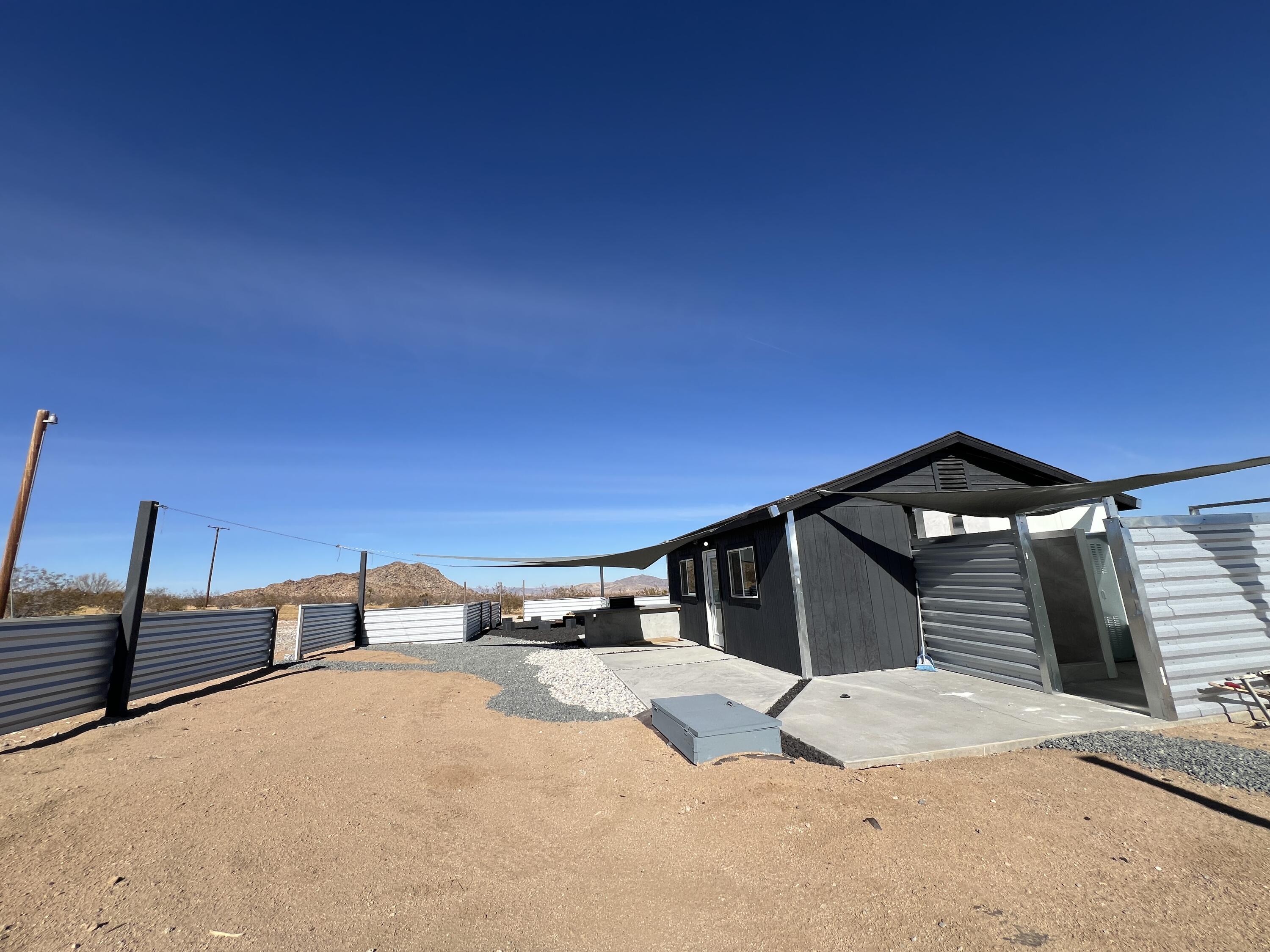 2774 Kickapoo Trail Landers, CA 92285 - Photo 18 of 51 a front view of a house with parking