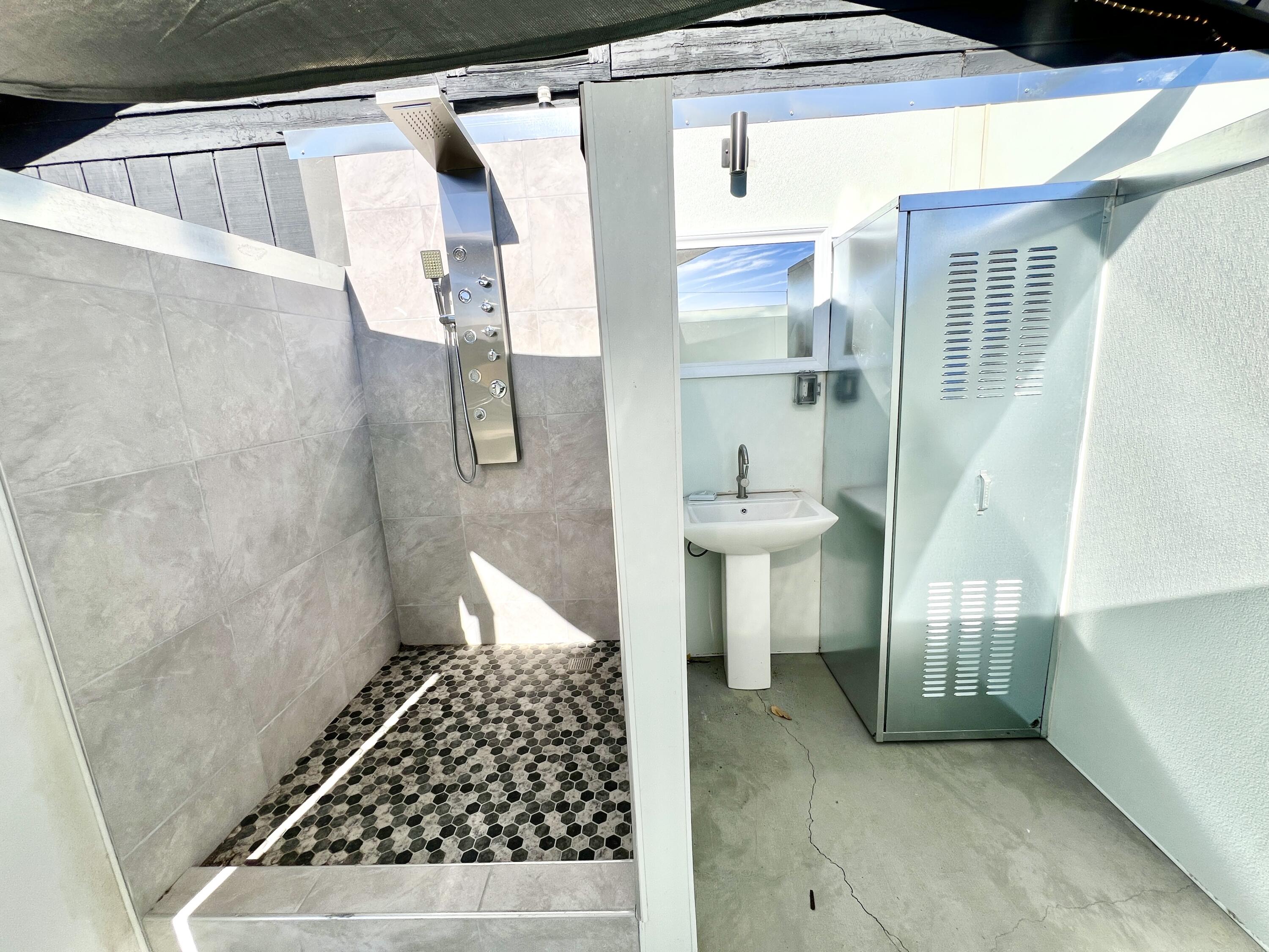 2774 Kickapoo Trail Landers, CA 92285 - Photo 20 of 51 a bathroom with a sink a toilet a shower and a window