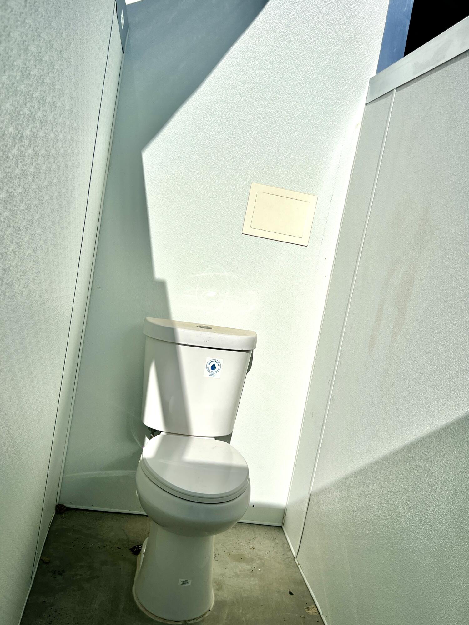 2774 Kickapoo Trail Landers, CA 92285 - Photo 21 of 51 a white toilet sitting next to a shower