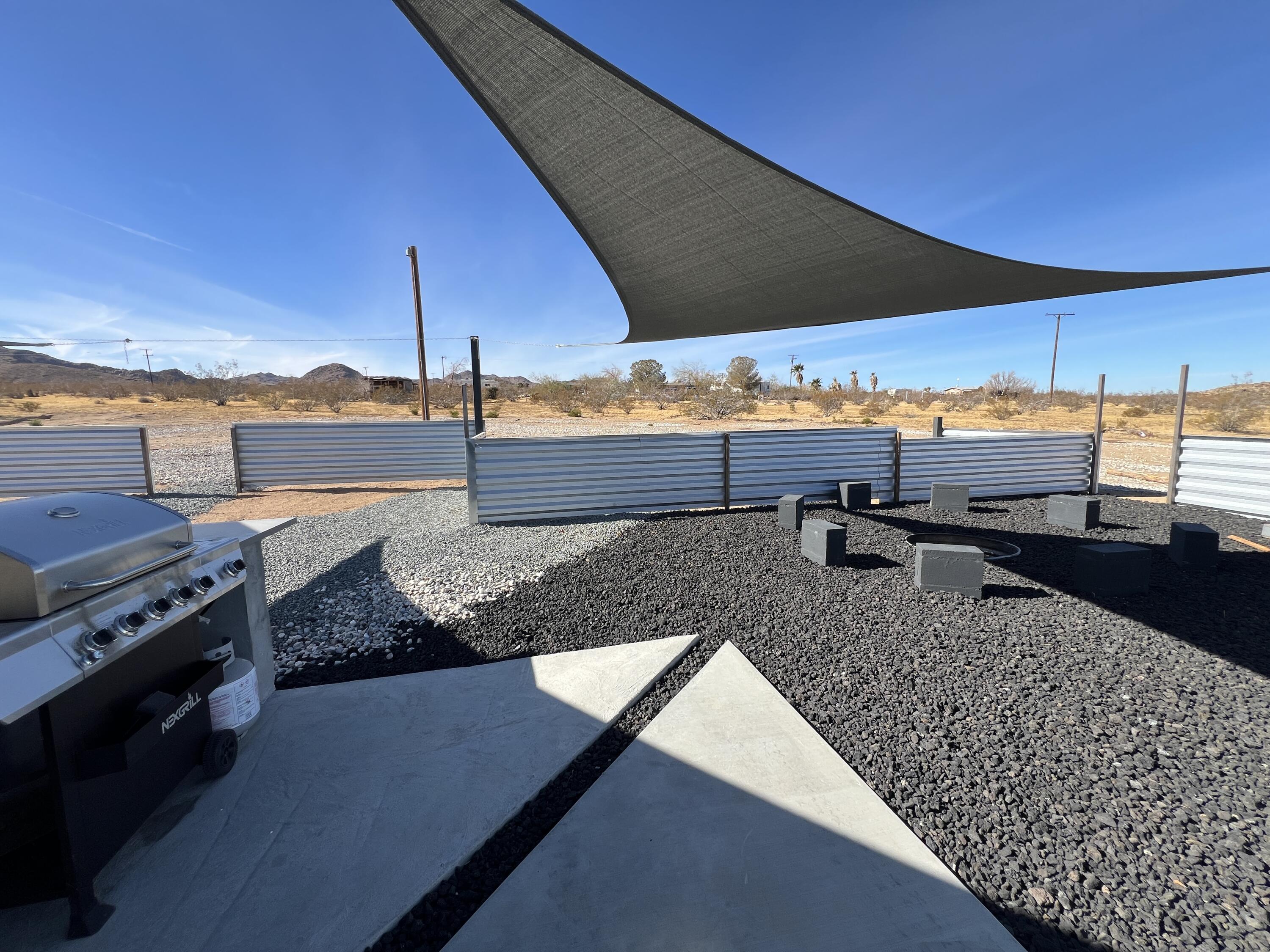 2774 Kickapoo Trail Landers, CA 92285 - Photo 26 of 51 a view of a terrace with lawn chairs