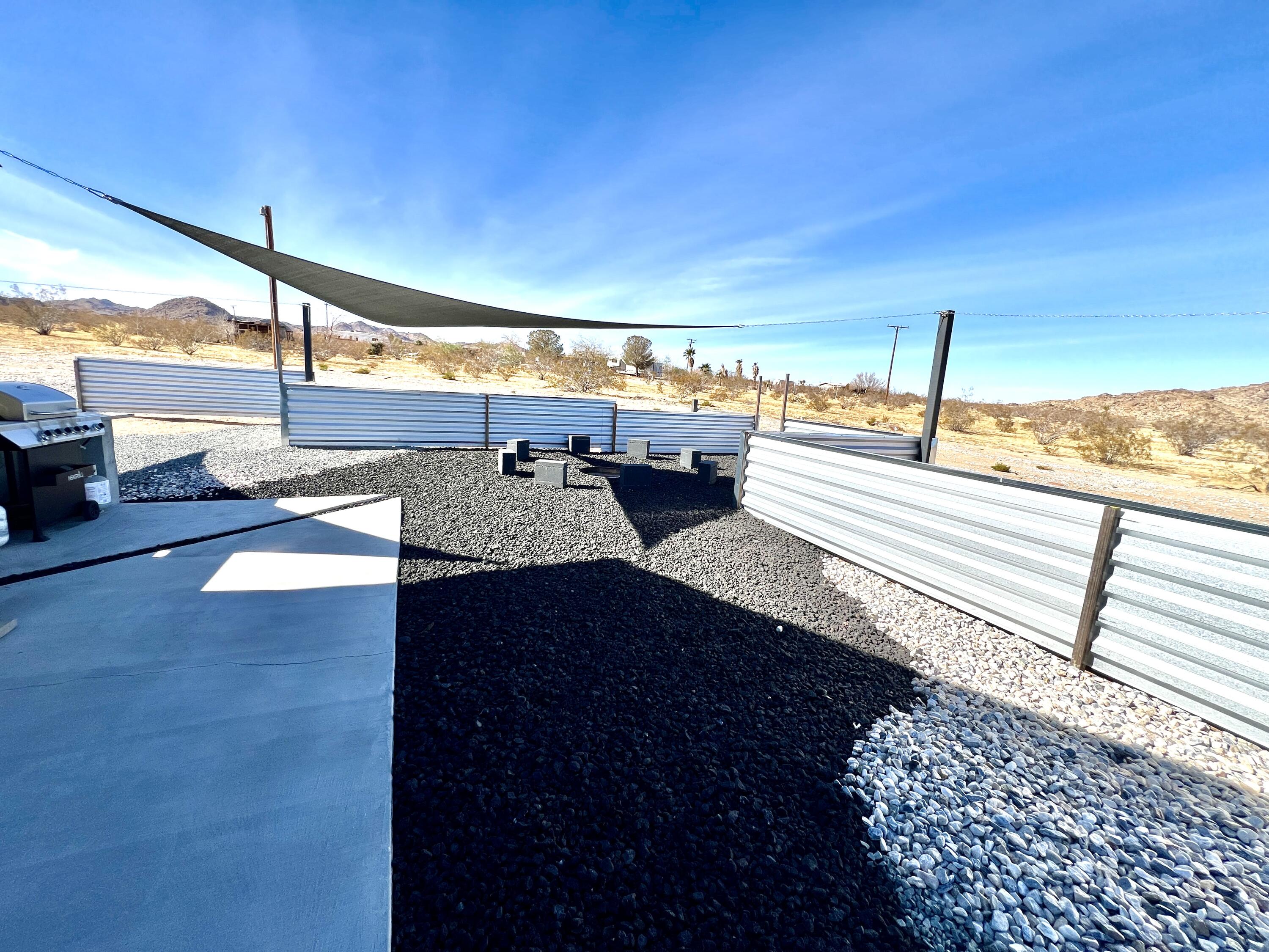 2774 Kickapoo Trail Landers, CA 92285 - Photo 27 of 51 a view of a balcony with floor to ceiling windows with wooden floor