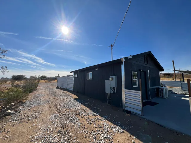 a yellow house with a outdoor space