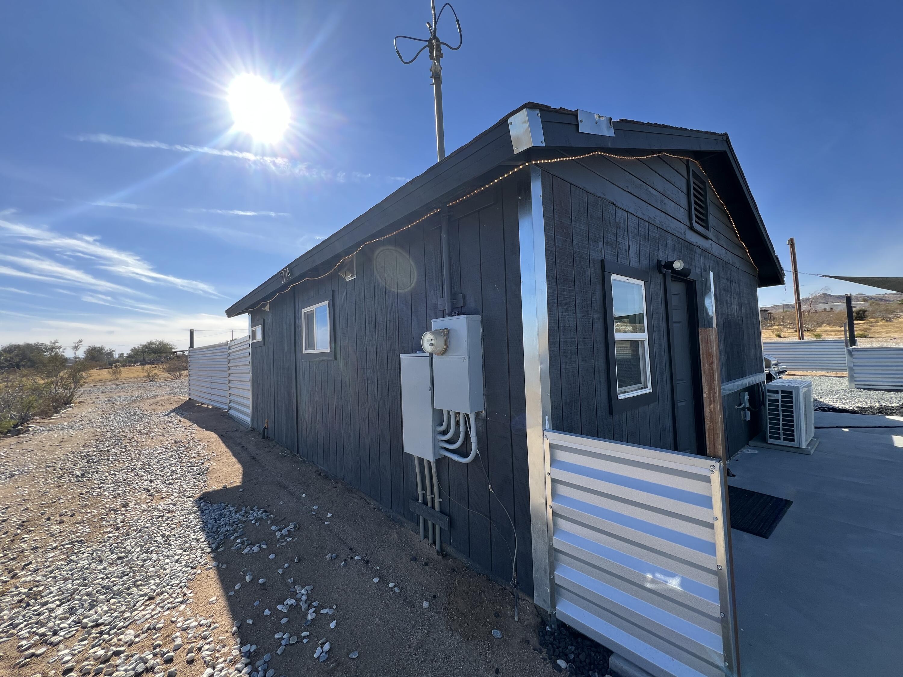2774 Kickapoo Trail Landers, CA 92285 - Photo 30 of 51 a yellow house with a outdoor space