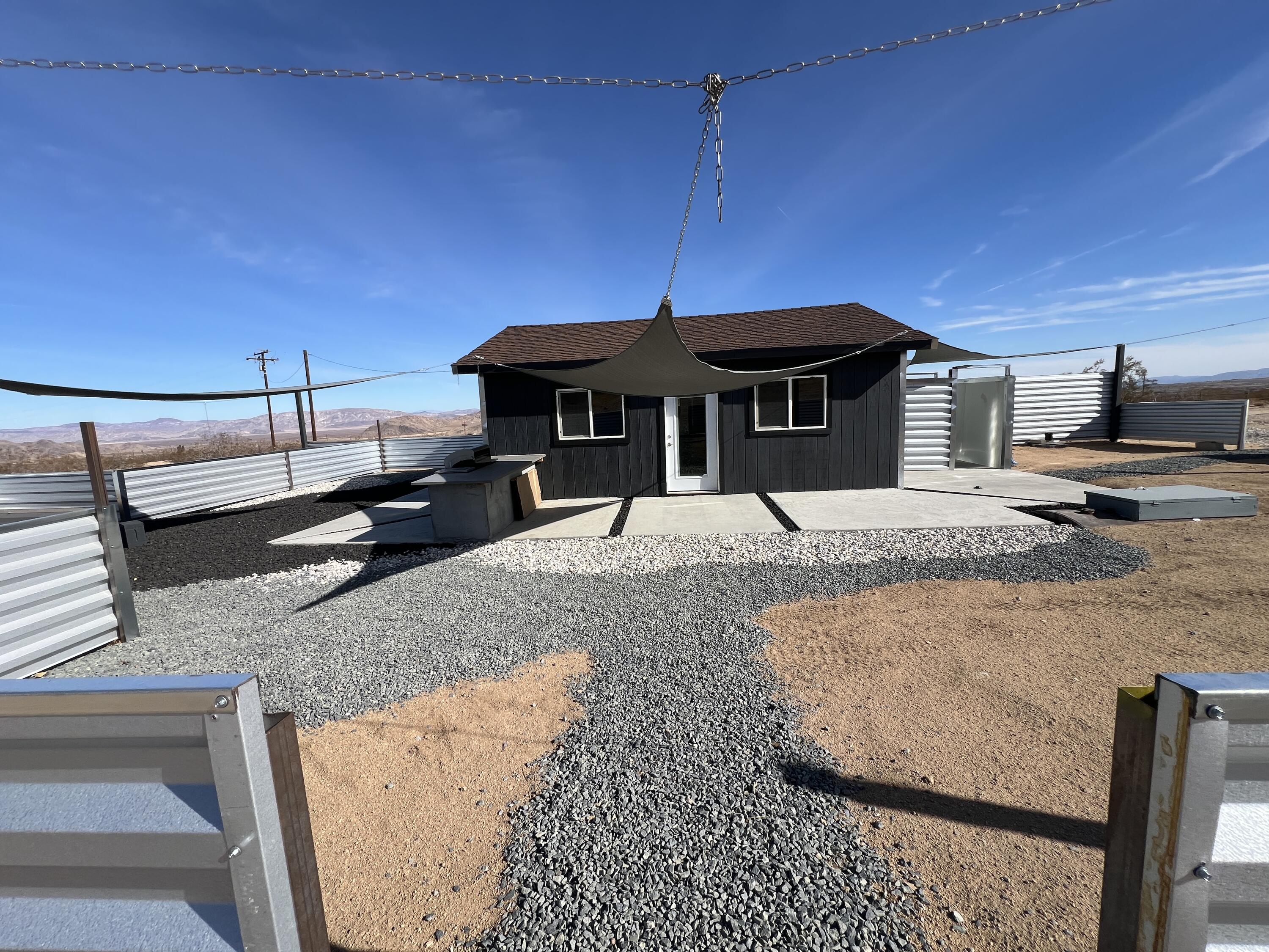 2774 Kickapoo Trail Landers, CA 92285 - Photo 38 of 51 a front view of a house with garden