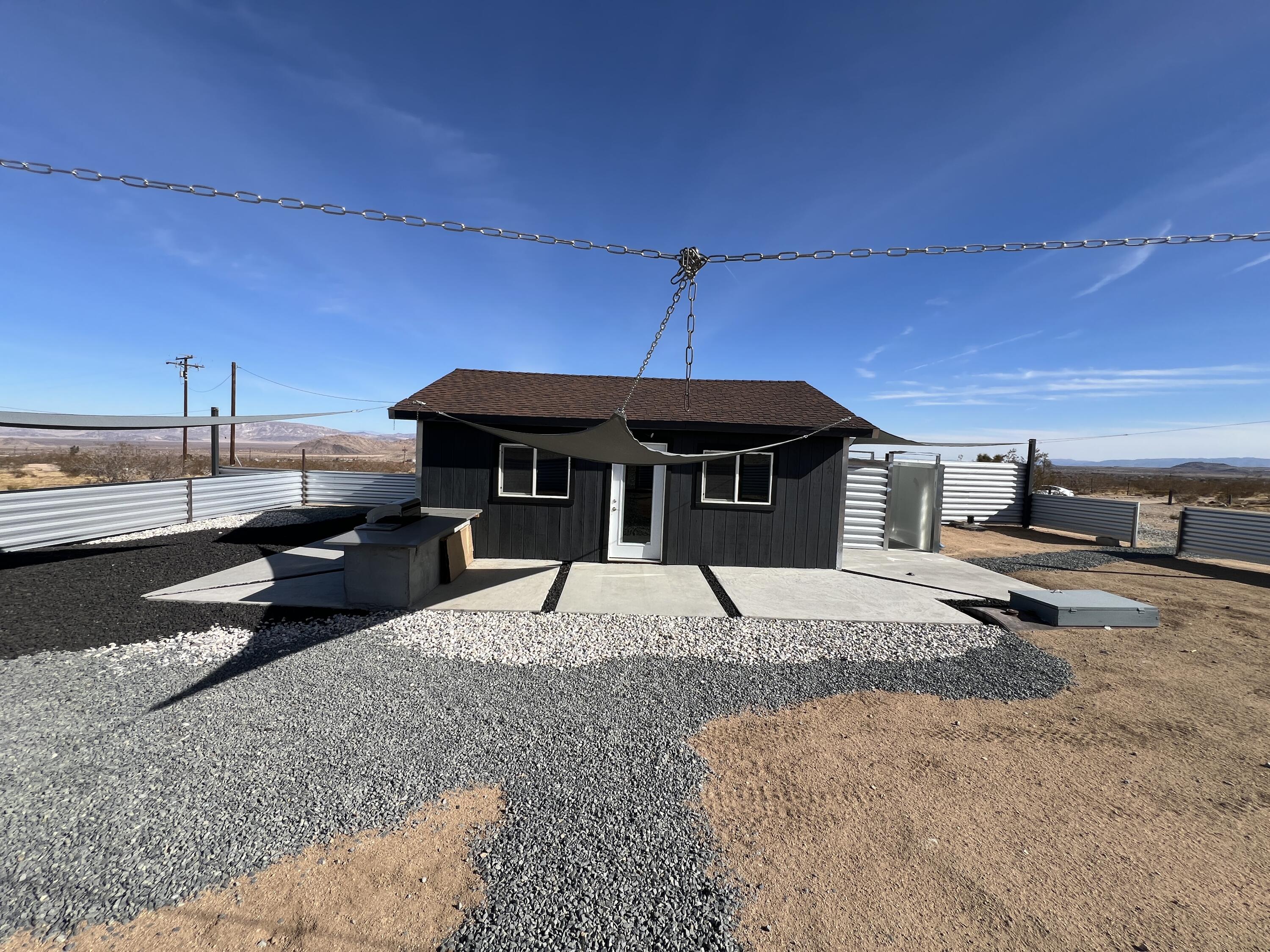 2774 Kickapoo Trail Landers, CA 92285 - Photo 39 of 51 a front view of a house with a yard