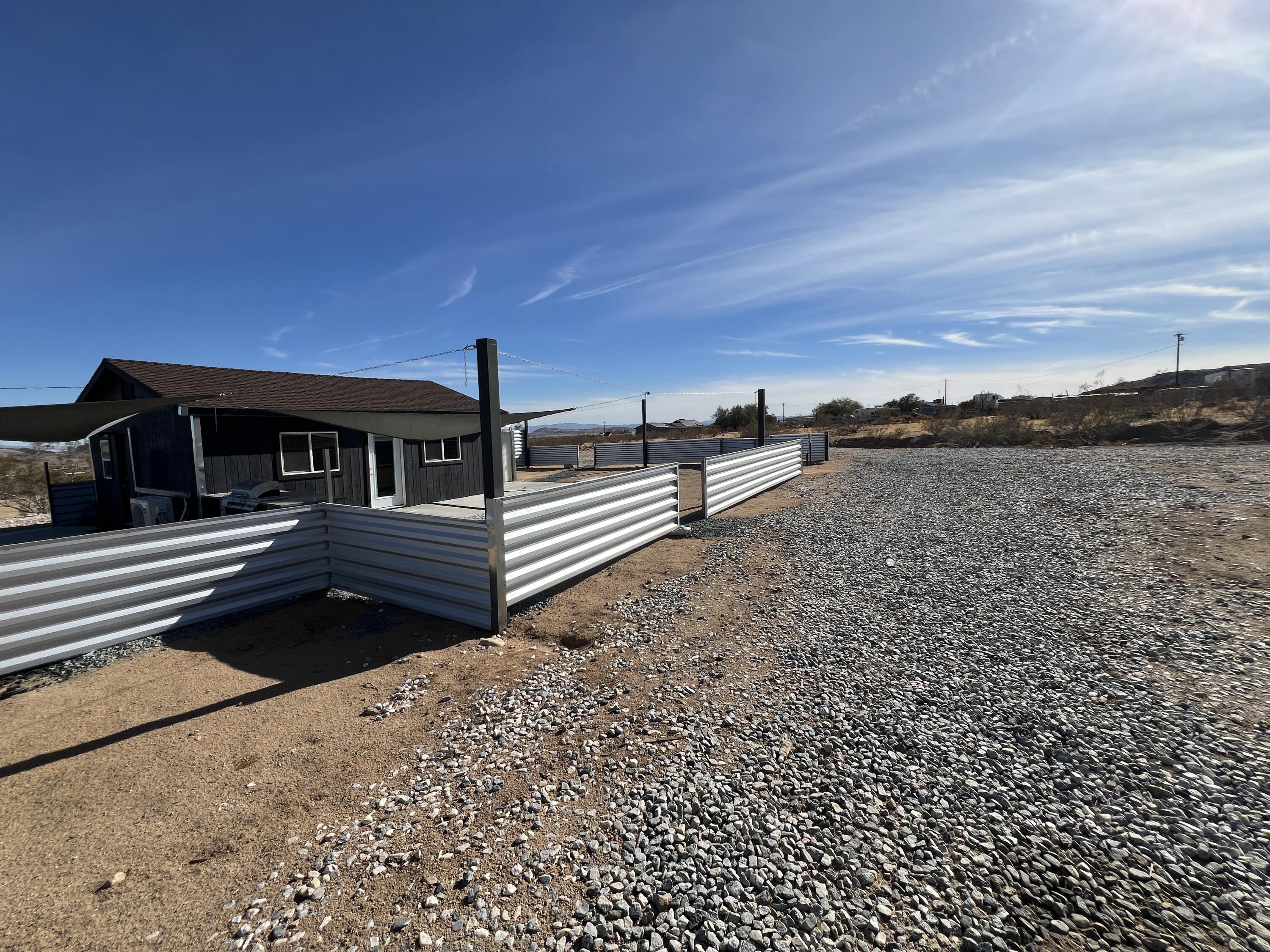 2774 Kickapoo Trail Landers, CA 92285 - Photo 42 of 51 a view of a house with a yard