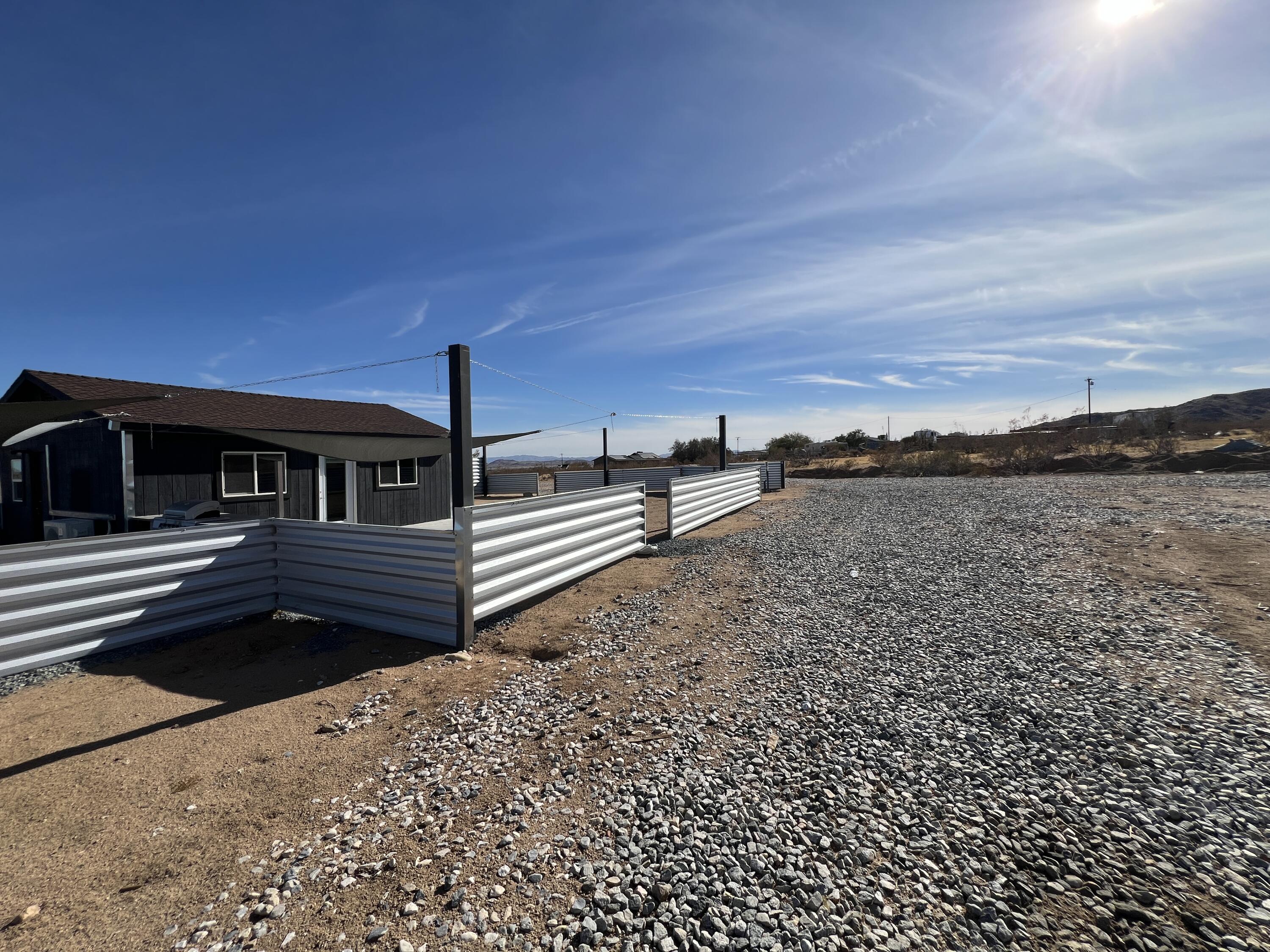 2774 Kickapoo Trail Landers, CA 92285 - Photo 46 of 51 a view of a terrace with a bench