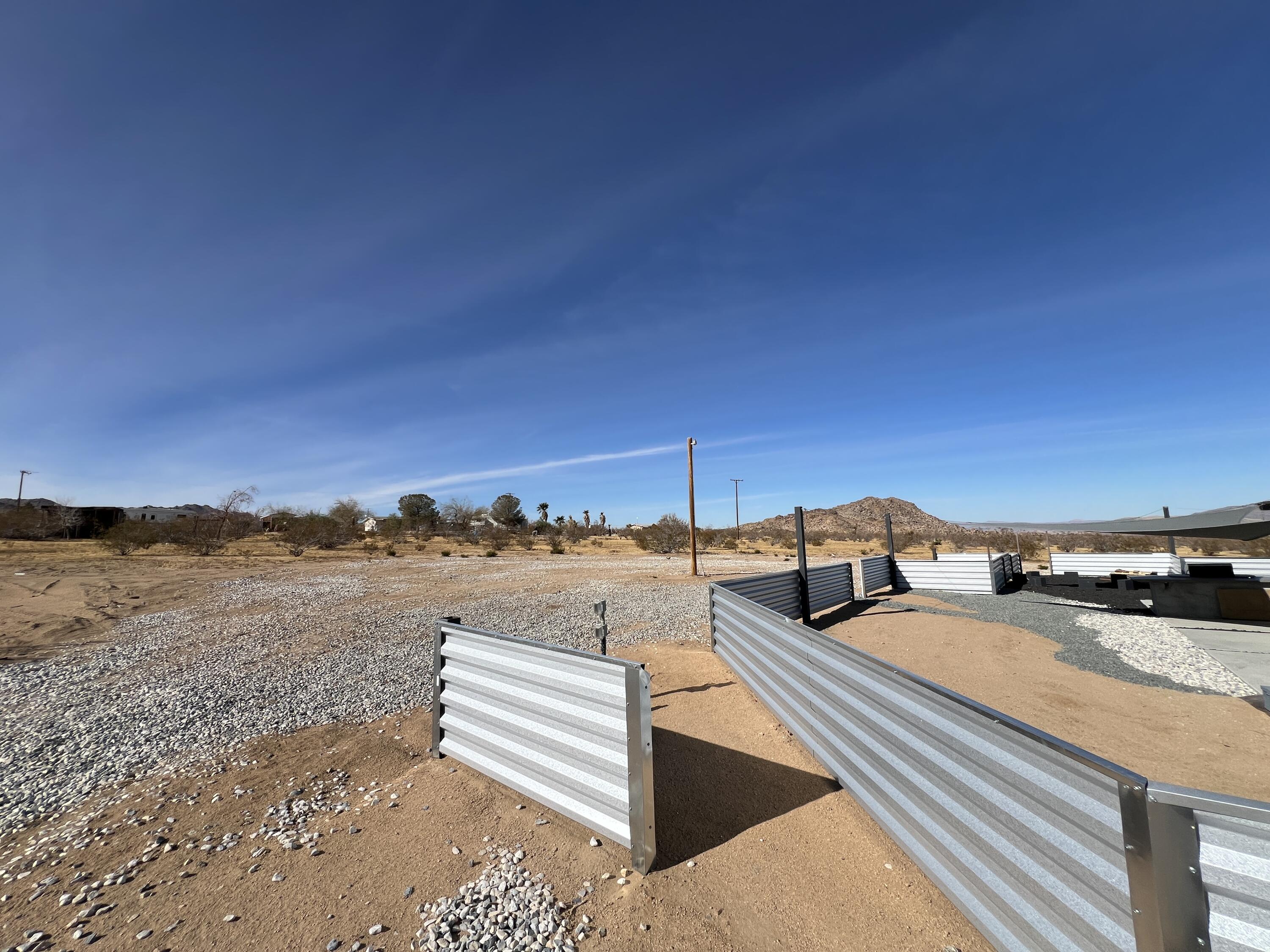 2774 Kickapoo Trail Landers, CA 92285 - Photo 47 of 51 a view of a terrace with wooden floor and city view
