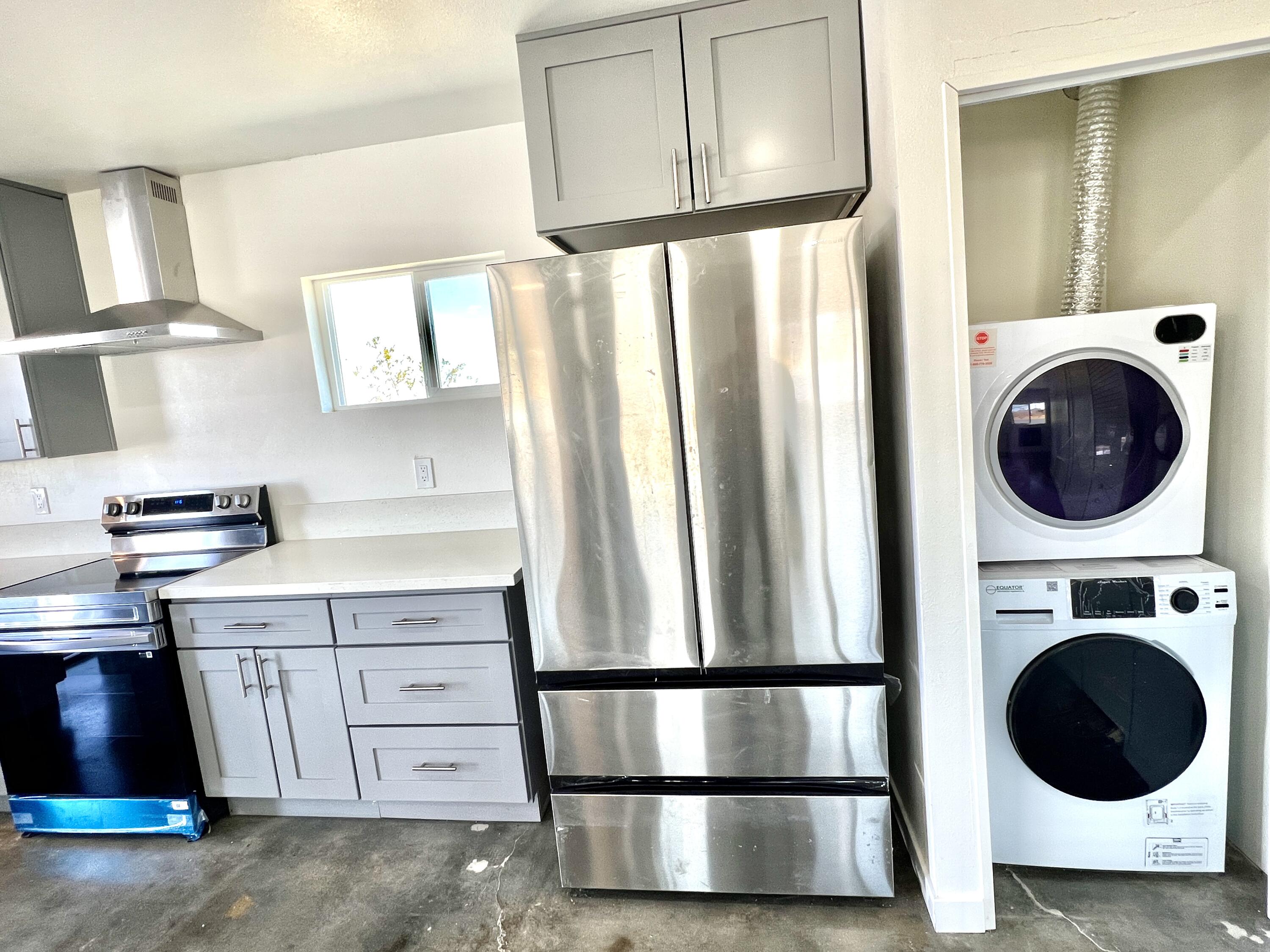 2774 Kickapoo Trail Landers, CA 92285 - Photo 5 of 51 a kitchen with kitchen island a stove a refrigerator and a sink