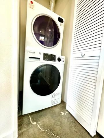 a close view of a utility room with a washer and dryer