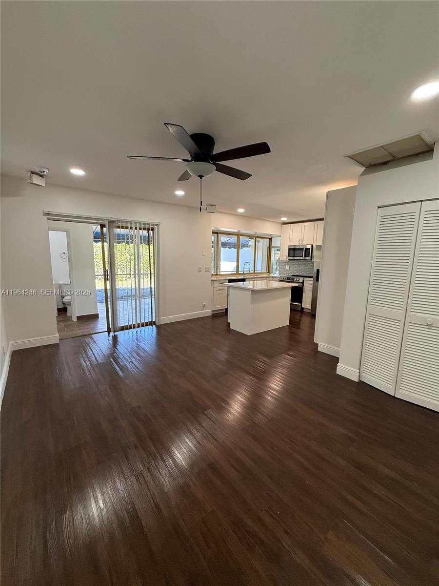 4917 West Park Road Hollywood, FL 33021 - Photo 11 of 25 a view of an empty room with wooden floor and a window
