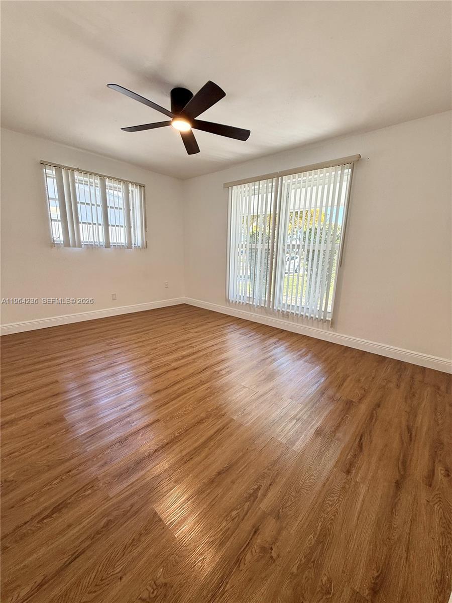 4917 West Park Road Hollywood, FL 33021 - Photo 15 of 25 a view of an empty room with wooden floor and a window