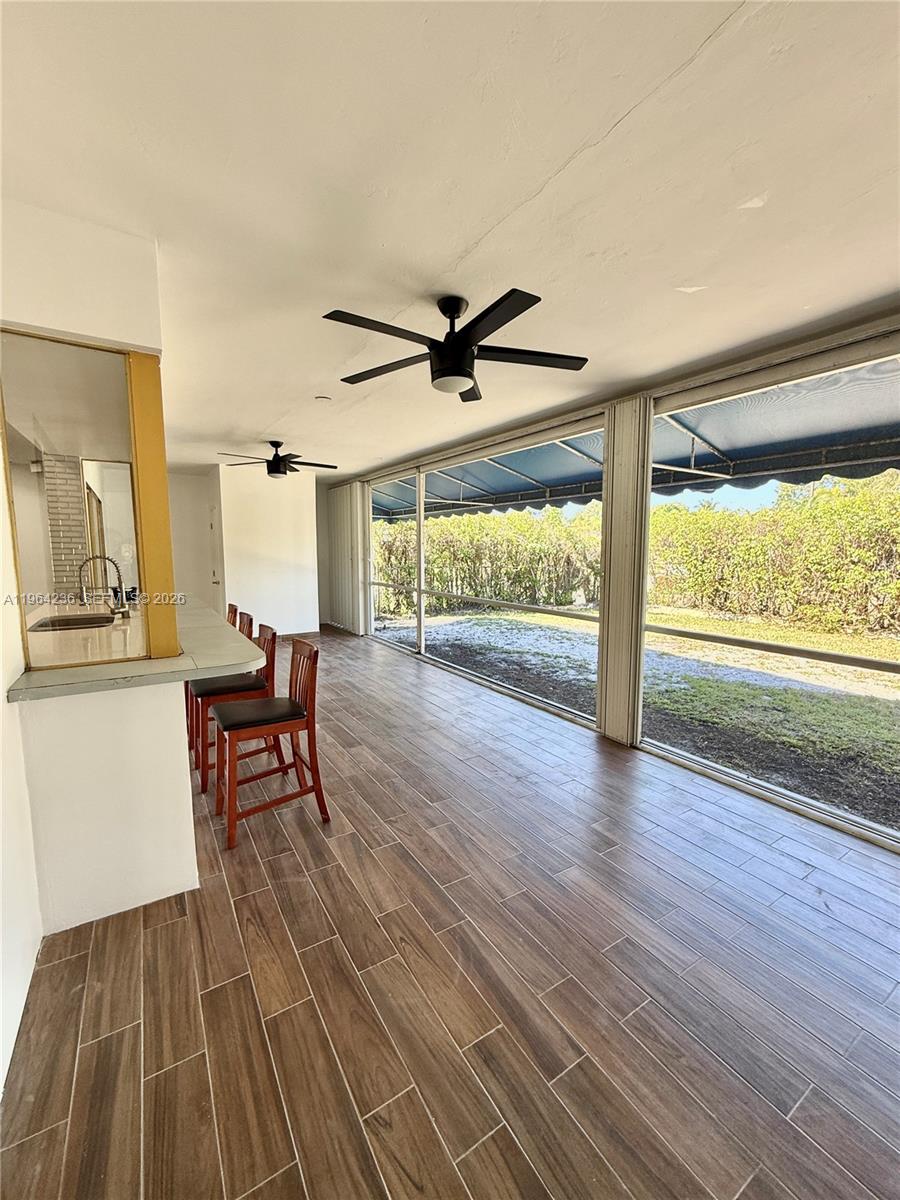 4917 West Park Road Hollywood, FL 33021 - Photo 18 of 25 a living room with furniture and a large window