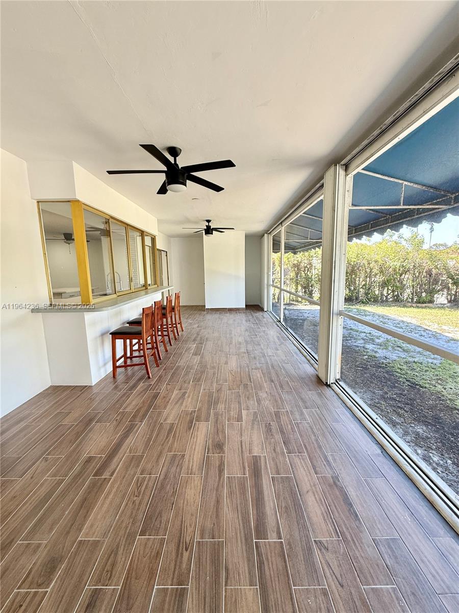 4917 West Park Road Hollywood, FL 33021 - Photo 19 of 25 a furnished livingroom with windows
