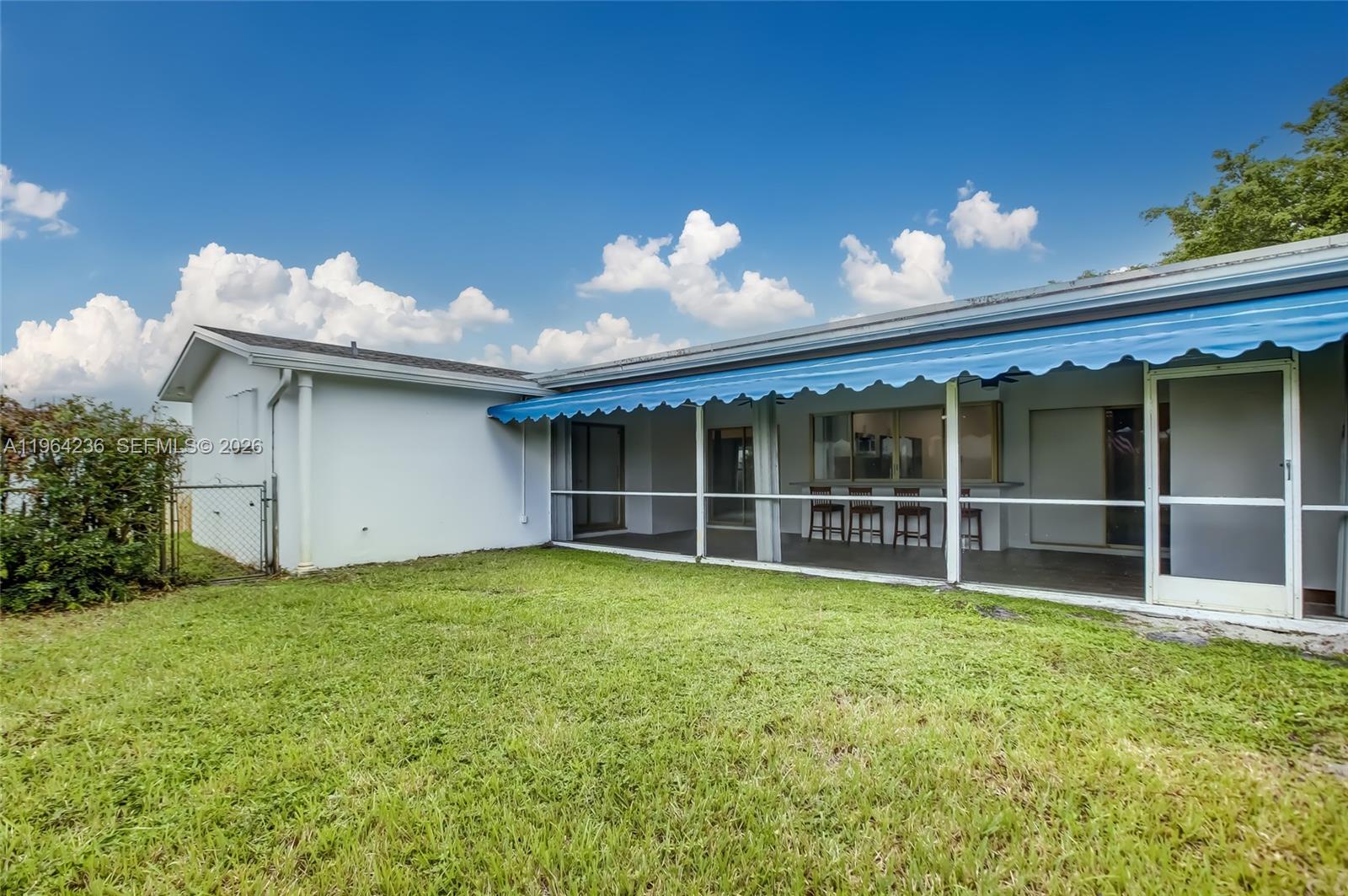 4917 West Park Road Hollywood, FL 33021 - Photo 23 of 25 a view of a house with a yard and a garden