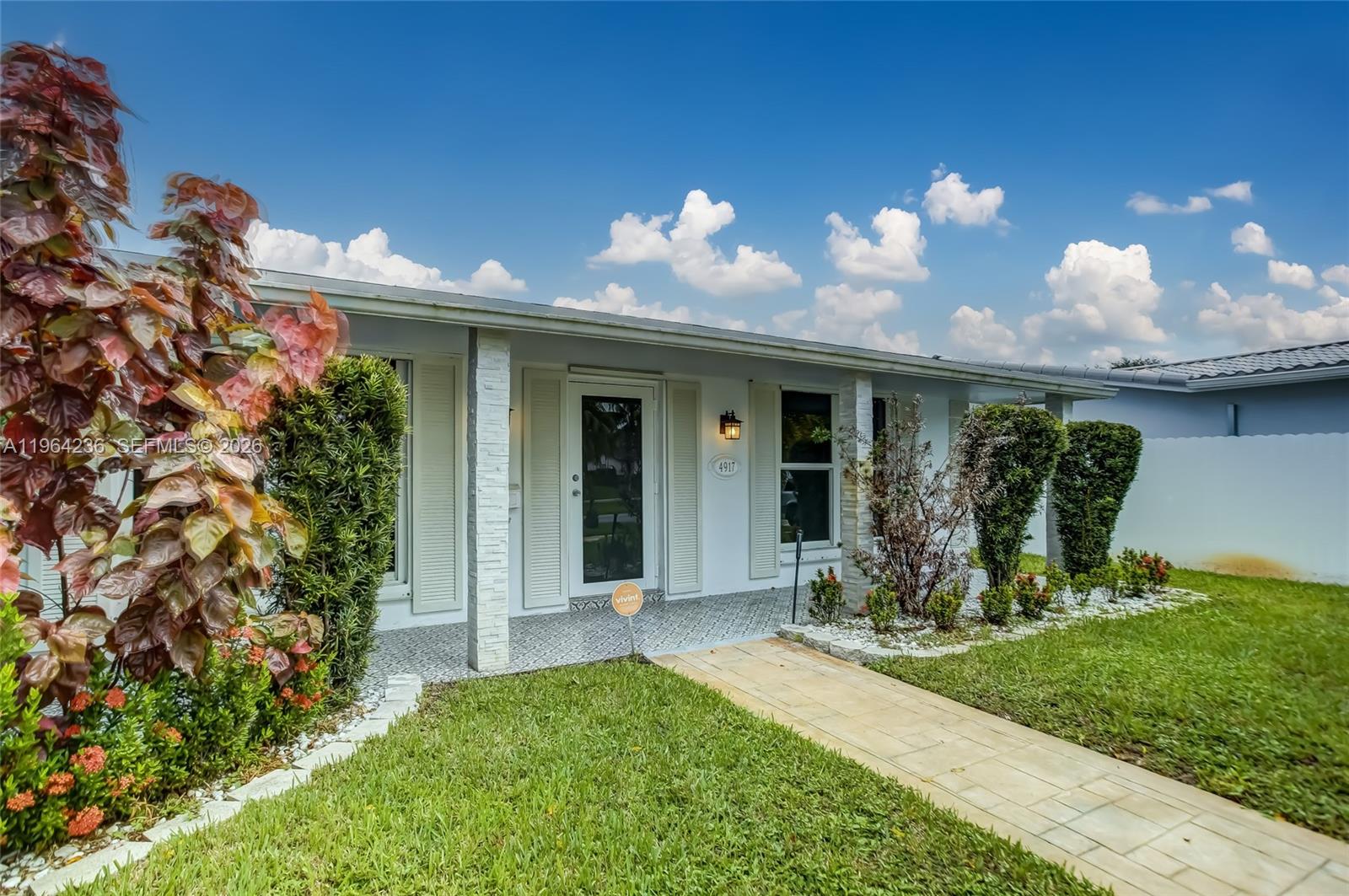 4917 West Park Road Hollywood, FL 33021 - Photo 4 of 25 a view of a porch with a yard