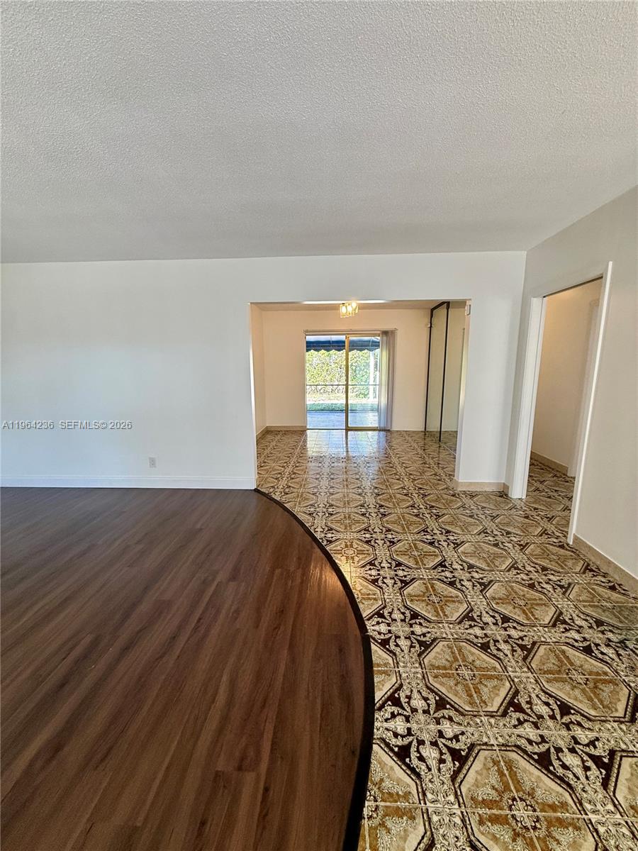 4917 West Park Road Hollywood, FL 33021 - Photo 5 of 25 wooden floor in a bedroom next to a window