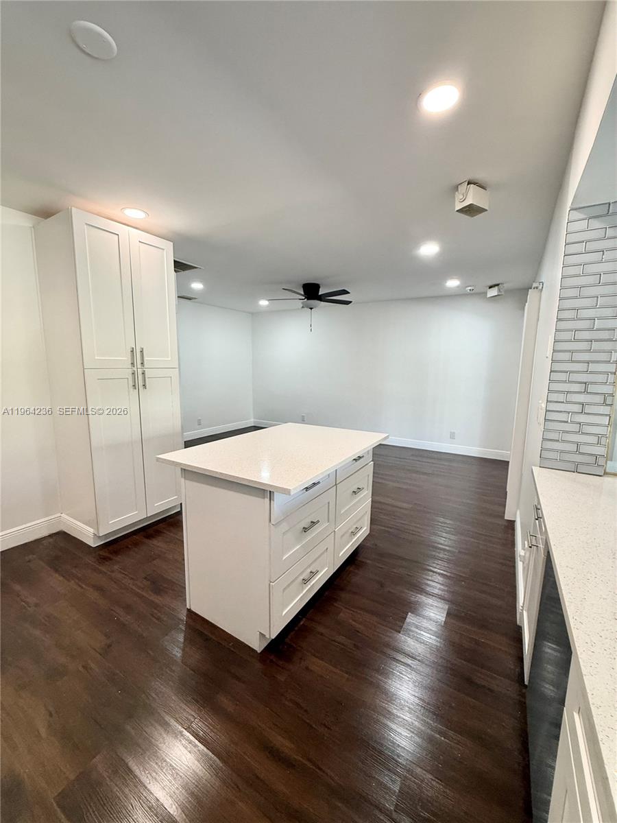 4917 West Park Road Hollywood, FL 33021 - Photo 9 of 25 a large white room with wooden floor