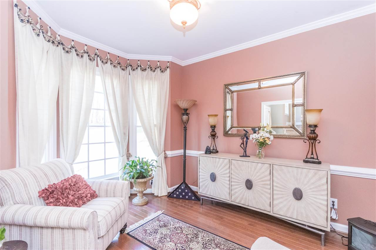 6020 Wild Orchid Trail Raleigh, NC 27613 - Photo 4 of 26 This flexible space with it's beautiful bay window is nicely set up to be a sitting room right now, but is designed to be the formal dining room. Dining Room