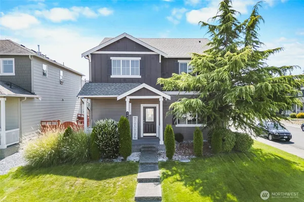 a front view of a house with a yard