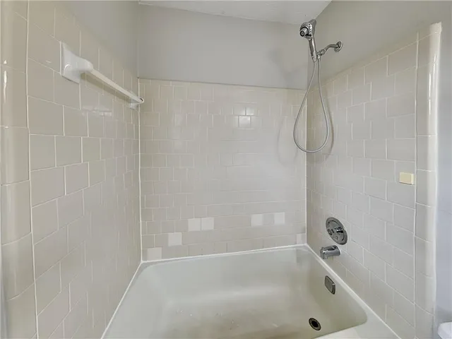 a close up of a bathtub in a bathroom