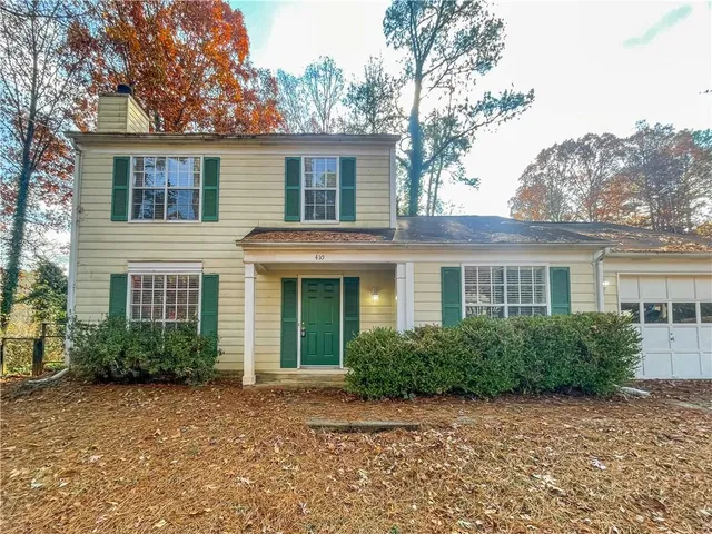 front view of a house with a yard