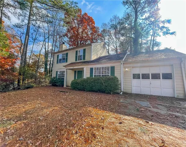 a view of a house with a garden