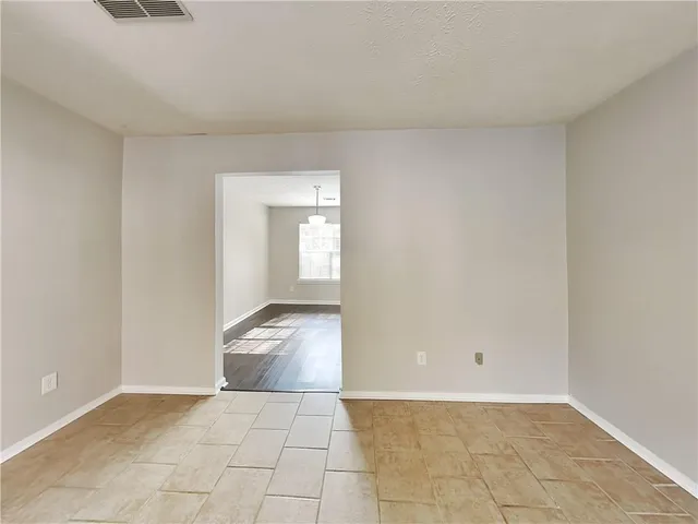a view of an empty room and window