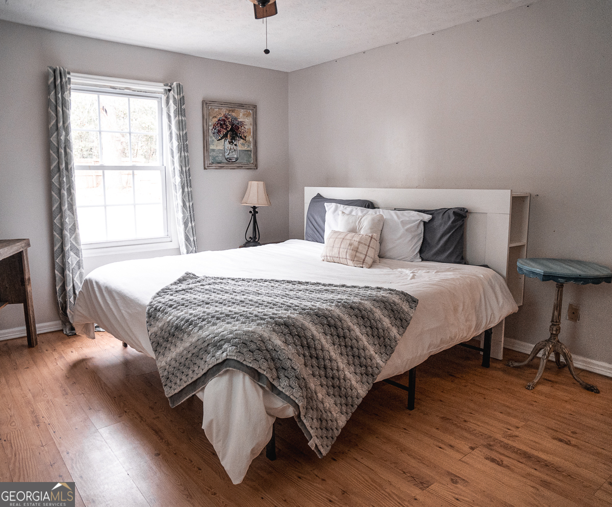 3305 Cherokee Avenue Columbus, GA 31906 - Photo 15 of 49 a bedroom with a bed and wooden floor