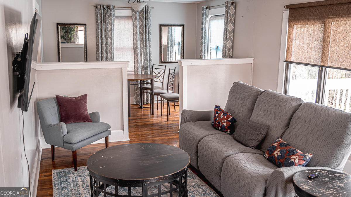 3305 Cherokee Avenue Columbus, GA 31906 - Photo 2 of 49 a living room with furniture and a large mirror
