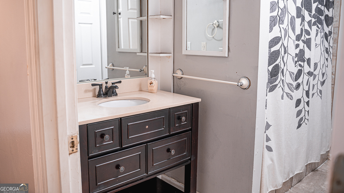 3305 Cherokee Avenue Columbus, GA 31906 - Photo 25 of 49 a bathroom with a sink and a mirror