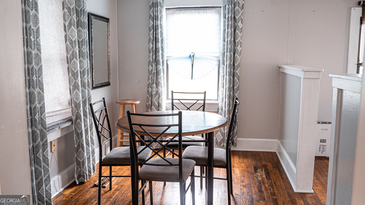 3305 Cherokee Avenue Columbus, GA 31906 - Photo 26 of 49 a view of a dining room with furniture and wooden floor