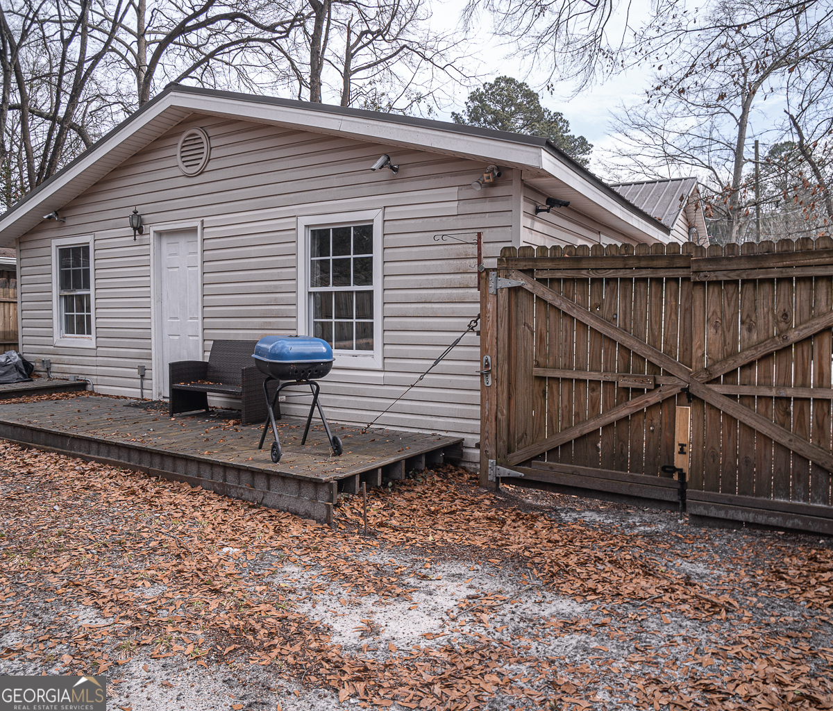 3305 Cherokee Avenue Columbus, GA 31906 - Photo 32 of 49 a view of backyard with wooden fence and large trees