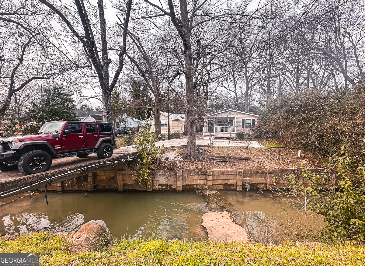 3305 Cherokee Avenue Columbus, GA 31906 - Photo 49 of 49 a front view of a house with lake view and boat