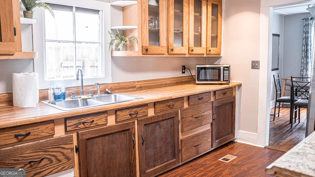 3305 Cherokee Avenue Columbus, GA 31906 - Photo 6 of 49 a kitchen with stainless steel appliances a sink and cabinets
