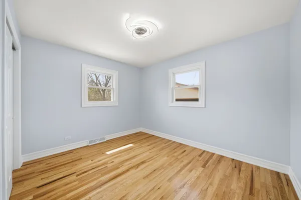 an empty room with a empty space and window