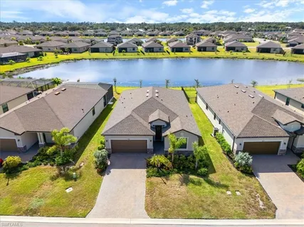 an aerial view of a house with a swimming pool